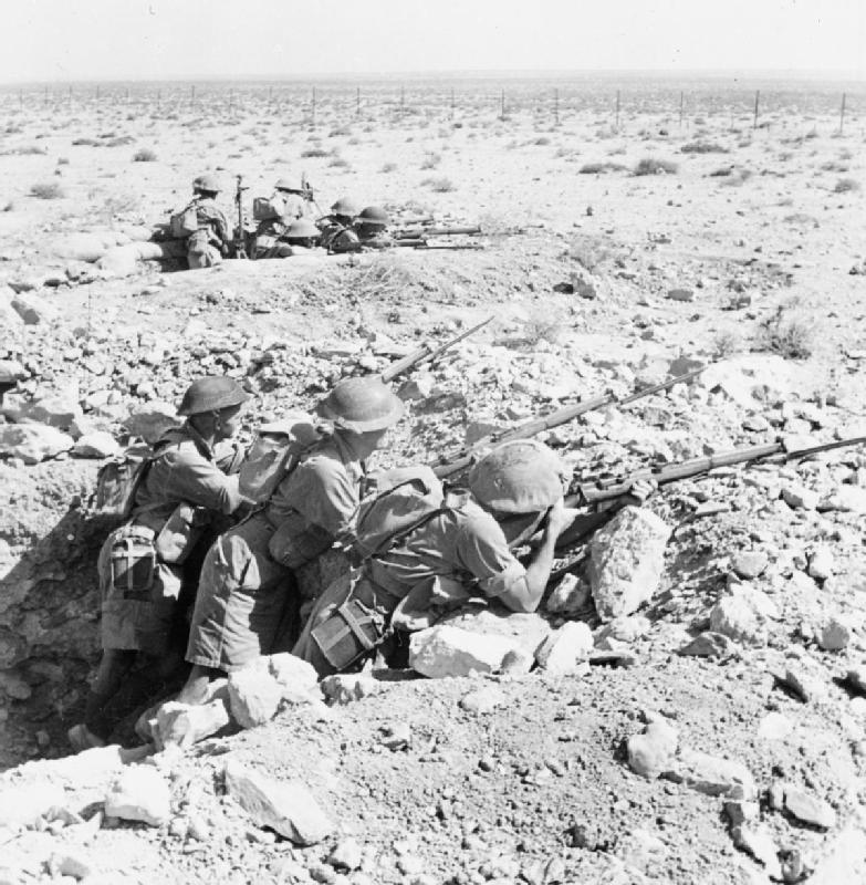 Australian troops in a foxhole near Tobruk, Libya, 13 Aug 1941 (Imperial War Museum: E 4792)