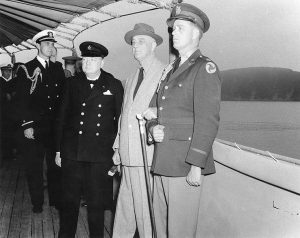 Winston Churchill, Franklin Roosevelt, and Roosevelt’s sons Franklin and Elliott aboard USS Augusta off Newfoundland, Aug 1941 (US Naval History and Heritage Command: NH 67201)