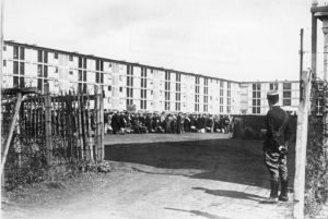 Accommodation block at Drancy with French gendarme on guard, Aug. 1941 (German Federal Archive, Bild 183-B10919)