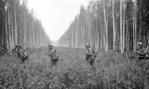 Finnish soldiers crossing the Finnish-Soviet border set at the end of the Winter War in 1940, crossing from Tohmajärvi, Finland, to Pälksaari, Russia, 12 July 1941 (Military Museum of Finland: 79952).