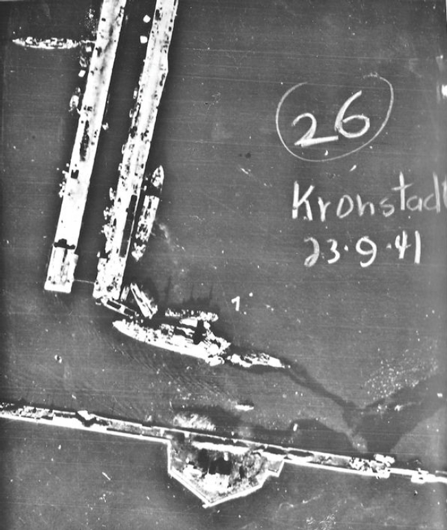 Luftwaffe aerial photograph of the damaged Soviet battleship Marat in Kronstadt, leaking oil, 27 September 1941 (Luftwaffe photo, public domain via Wikipedia)