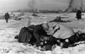 German soldiers tend to a wounded comrade near Moscow, November 1941 (German Federal Archive: Bild 146-2008-0317)