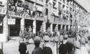 Japanese victory parade in Hong Kong, Dec 1941 (public domain via Wikipedia)
