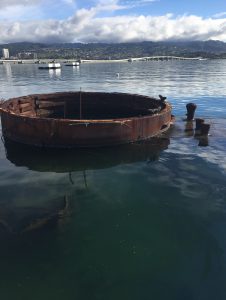 USS Arizona, viewed from the memorial; note the oil on the water (Photo: Sarah Sundin, 7 Nov 2016)