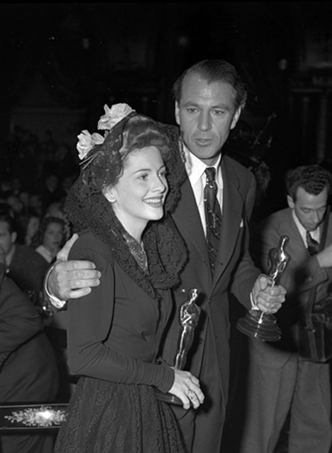 Joan Fontaine and Gary Cooper holding their Oscars at the Academy Awards after party, Feb. 26, 1942 (public domain via Los Angeles Times photographic archive, UCLA Library)