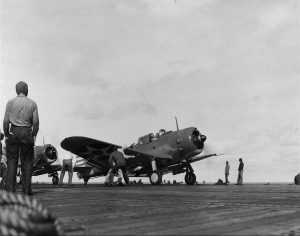 SBD-2 Dauntless dive bomber on carrier USS Enterprise prepares for takeoff during the 1 Feb 1942 Marshall Islands Raid (National Naval Aviation Museum: NNAM.1996.253.599)