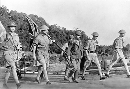 ” British Army Lt. Gen. Arthur Percival and his party on their way to surrender Singapore to the Japanese, 15 Feb 1942 (Imperial War Museum: HU 2781)