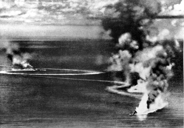 Heavy cruisers HMS Dorsetshire and HMS Cornwall burning during the raid on Ceylon, 5 Apr 1942; photo taken from Japanese aircraft (US Navy photo 80-G-71202)