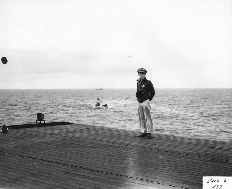 Capt. Daniel Gallery on flight deck of USS Guadalcanal with captured German U-boat U-505 in tow, June 1944 (US National Archives)