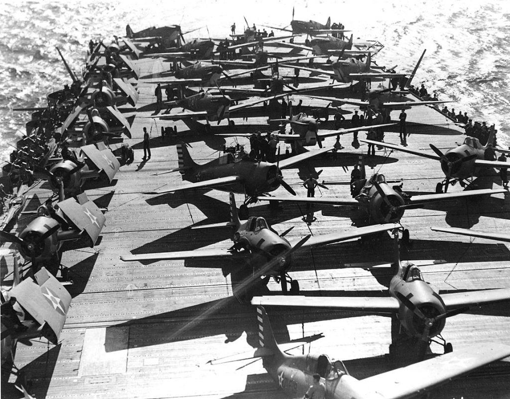 US Navy F4F-4 Wildcats and Royal Air Force Spitfires on the deck of aircraft carrier USS Wasp en route to Malta, 19 April 1942 (US Navy National Museum of Naval Aviation photo 1996.253.7386.029)