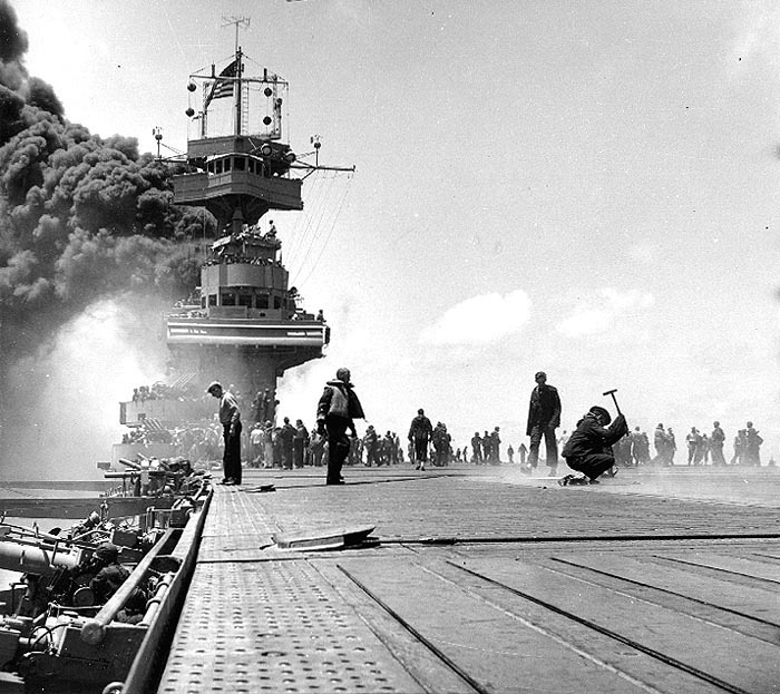 Carrier USS Yorktown burning after hit by three Japanese bombs, 4 Jun 1942 (US National Archives) 