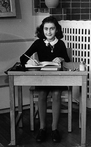 Anne Frank at school, Amsterdam, the Netherlands, 1940 (public domain via Wikipedia)