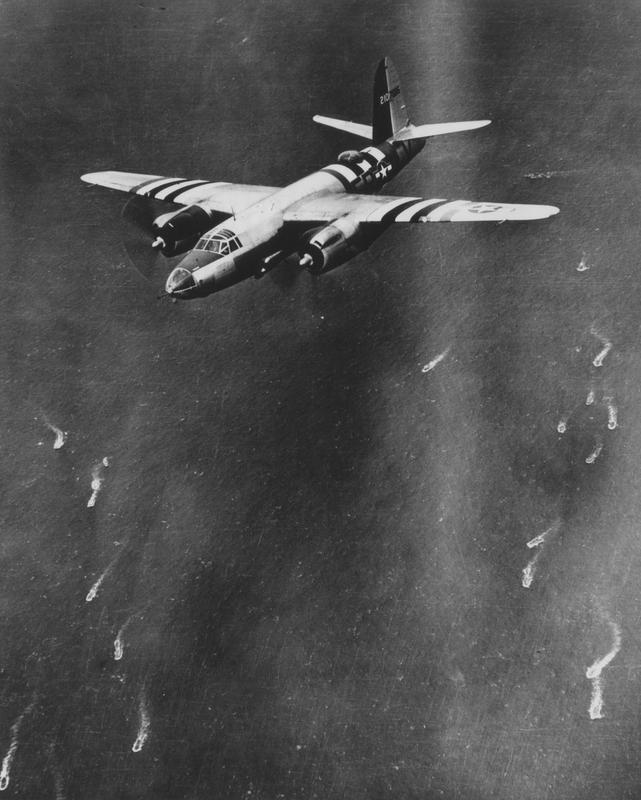 A B-26 Marauder of the 322nd Bomb Group in flight over ships heading for Normandy on D-Day, 6 June 1944. (Imperial War Museum, Roger Freeman Collection)