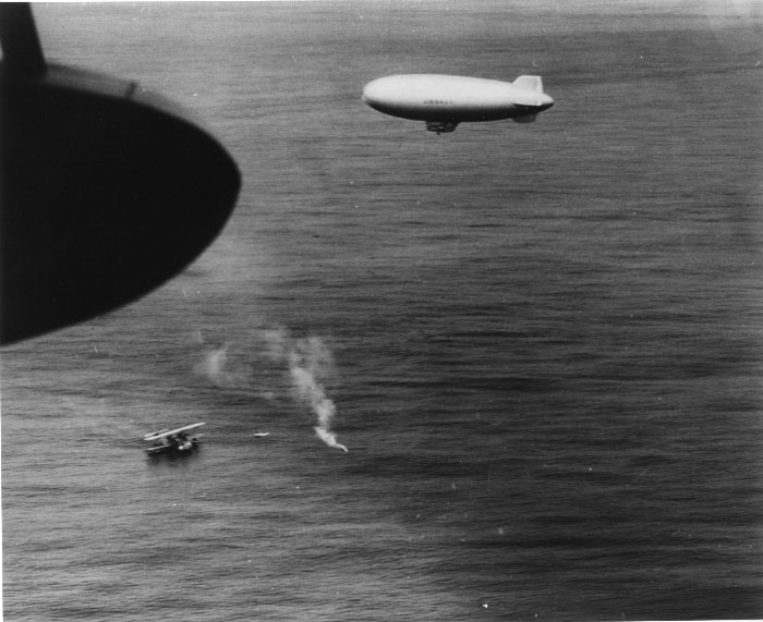 US Coast Guard PH-2 seaplane lands to rescue survivors from U-701 - Navy K-type airship overhead had located survivors and dropped raft and supplies. An Army A-29 had sunk U-701 on 7 July 1942 off Wilmington, NC. This rescue took place on 9 July 1942. (US Navy photo)
