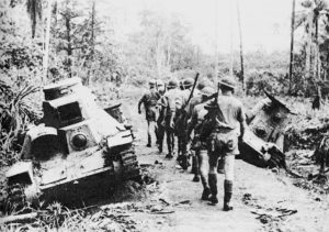 Australian troops passing abandoned Japanese tanks at Milne Bay, New Guinea, September 1942 (US Army Center of Military History)