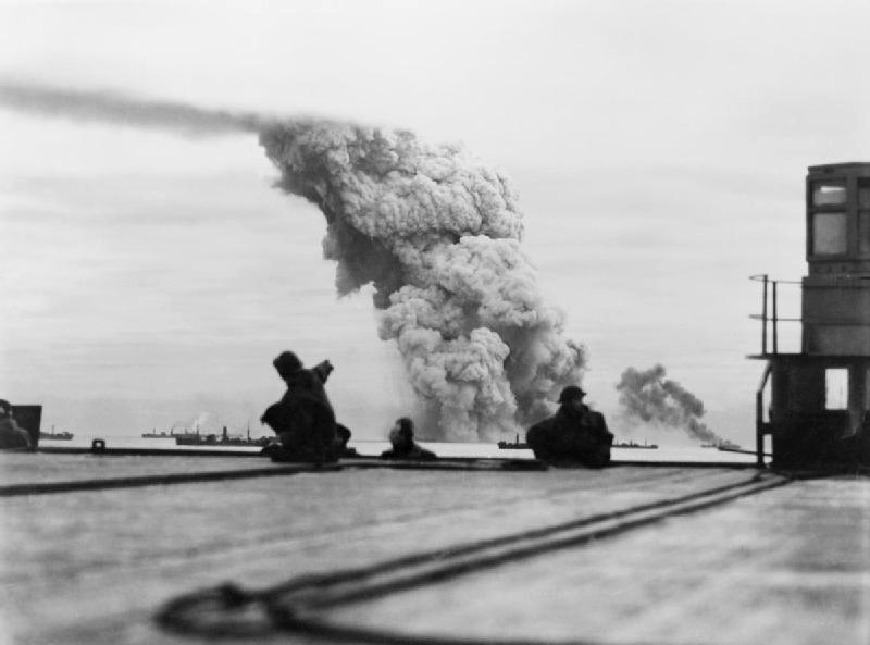 Smoke rising from ammunition ship Mary Luckenbach in Allied convoy PQ-18, 13 Sep 1942; seen from escort carrier HMS Avenger (Imperial War Museum: A 12017)