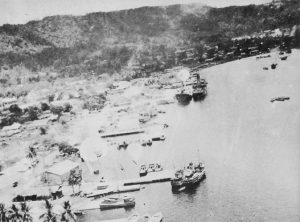 US Fifth Air Force parachute fragmentation bombs falling on docks at Rabaul, New Britain, 2 November 1943 (Library of Congress)