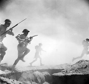 Australian soldiers running toward the front lines during reenactment of Second Battle of El Alamein, 24 Oct 1942 (Imperial War Museum: 4700-32 E 18474)