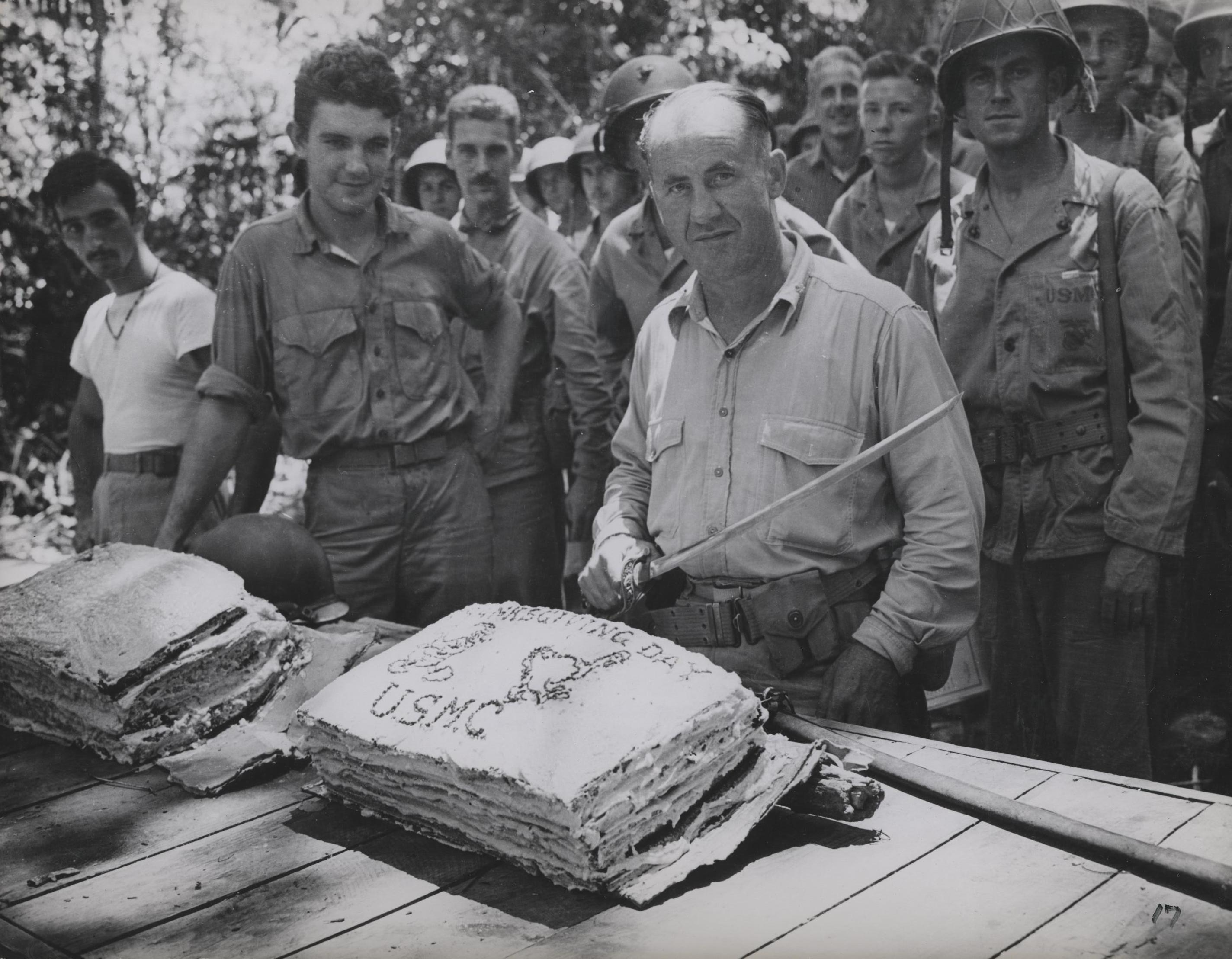 USMC Lt. Col. W.W. Stickney preparing to cut a Thanksgiving cake with a captured Japanese sword, Guadalcanal, 26 Nov 1942 (US Marine Corps photo)