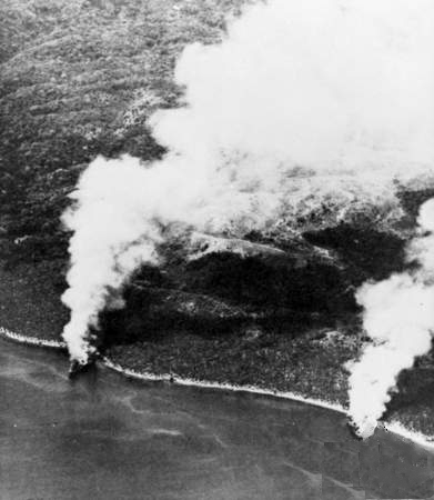 Japanese transports Hirokawa Maru and Kinugawa Maru beached and burning after a failed resupply run to Guadalcanal, 15 November 1942 (Australian War Memorial: P02018.165)