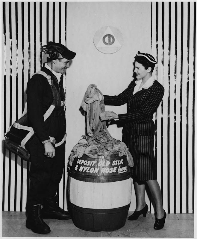 Deena Clark, Civilian Defense (right), and Tech. Sgt. Leo Malkins of the Army Air Forces (left) collecting used stockings (Franklin D. Roosevelt Presidential Library & Museum),