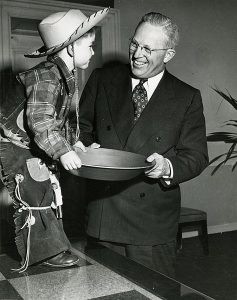 California Governor Earl Warren with a small boy dressed as a prospector, during the California Centennial Celebration, 1948-50 (California State Archives)
