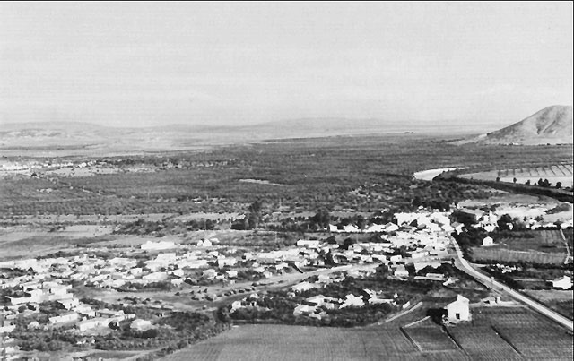 El Bathan, Tunisia, the Medjerda river, and Tebourba, the cluster of white buildings in the left background (US Army Center of Military History)