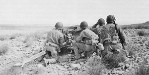 US 37-mm antitank gun (M3A1) and crew wait for the German column through Faïd Pass, Tunisia, 14 February 1943 (US Army Center of Military History)