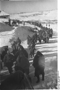German soldiers marching to a Soviet prisoner of war camp, Stalingrad, Russia, Feb 1943 (German Federal Archive: Bild 183-E0406-0022-010)