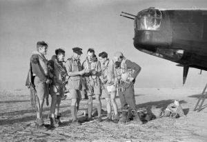 Crew of an RAF Wellington at Kairouan Airfield, Tunisia, being briefed before a bombing raid to Sicily, 9 July 1943 (Imperial War Museum)