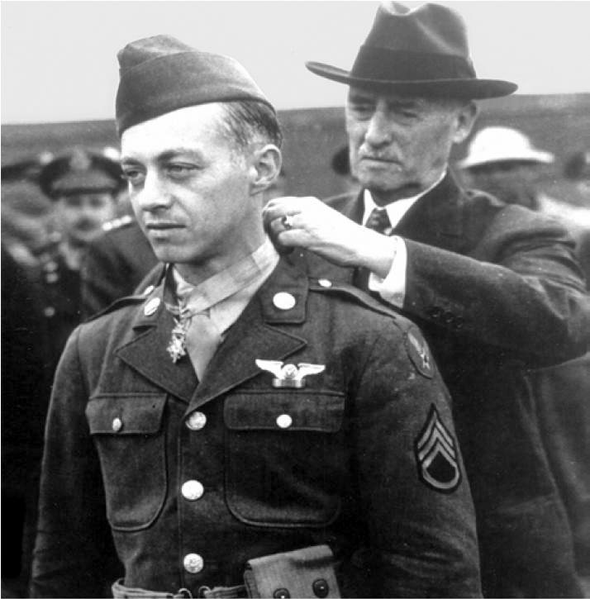 Secretary of War Henry Stimson awarding the Medal of Honor to Staff Sgt. Maynard “Snuffy” Smith of 306th Bombardment Group, 12 July 1943 (US Army Air Force photo)