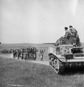 German troops surrender to the crew of a Stuart tank in Tunisia, 6 May 1943 (Imperial War Museum: NA 2514)