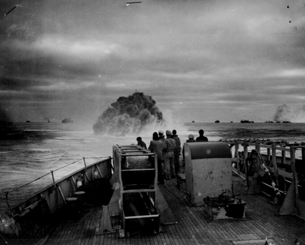 Crew of US Coast Guard Cutter Spencer watch as their depth charge explodes near German U-boat U-175, 17 April 1943 (US National Archives: 26-G-1517)