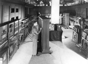 Cpl. Irwin Goldstein sets switches on one of the ENIAC's function tables at the Moore School of Electrical Engineering, University of Pennsylvania, 1946 (US Army photo)