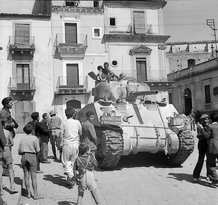Sherman tank of XIII Corps, British Eighth Army in Francofonte, Sicily, 13-14 Jul 1943 (Imperial War Museum: 4700-39 NA 4448)