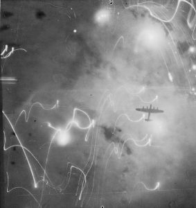 RAF Lancaster bomber over Hamburg, Germany, January 30/31, 1943 (Imperial War Museum: C-3371)