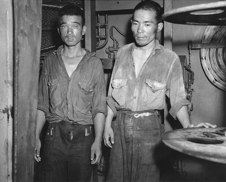 Survivors from Japanese light cruiser Jintsu, dressed in US Navy uniforms, aboard destroyer USS Nicholas, 13 Jul 1943 (US National Archives)