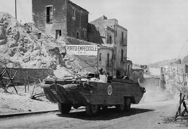 US DUKW carrying supplies in Porto Empedocle, Sicily (US Army Center of Military History)