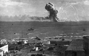 American transport SS Robert Rowan exploding after being hit by German Ju 88 bombers, Gela, Sicily, 11 July 1943—all 421 aboard survive (US Army Signal Corps photo: MM-43-L-1-23)
