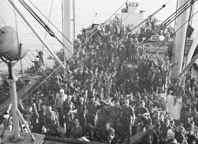 US troops en route to landing beaches at Salerno, Italy cheer the Italian surrender, 8 September 1943 (US Center for Military History)
