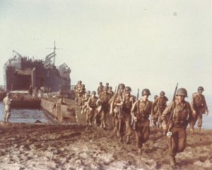 USS LST-1 landing US troops on a beach near Salerno, Italy, September 1943 (US National Archives: USA C-175)