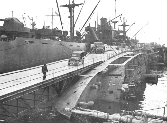 Pier built by US Army engineers over hull of sunken ship, Naples, 1943 (US Army Center for Military History)