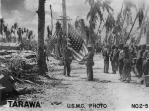 Marines raising US flag on Tarawa, Gilbert Islands, Nov 1943 (US Marine Corps photo No. 2-5)