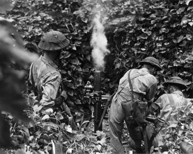 New Zealand soldiers training with a 3-inch mortar on Mono, Treasury Islands, 1943 (National Library of New Zealand)