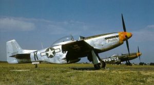 P-51D Mustangs of the US 357th Fighter Group, Leiston, England, 1944-45; P-51 in foreground in natural finish, P-51 in background in camouflage paint (US National Archives)