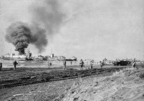 US Army troops land at Anzio, Italy, while ships are bombed by the Luftwaffe, January 1944 (US Army photo)