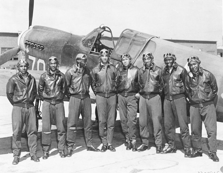 Men of the US 99th Fighter Squadron (“Tuskegee Airmen”) and a P-40 fighter in North Africa, 1943 (US Air Force photo: 25502027)