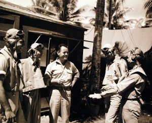 Maj. Gregory “Pappy” Boyington (center) with Marine Attack Squadron VMF 214 (Black Sheep Squadron) on Turtle Bay Fighter Strip, Espiritu Santo, New Hebrides, 11 September 1943 (US Navy photo 80-G-54302)