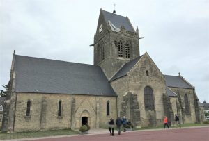 Church of Sainte-Mère-Église, France, where US paratroopers landed on D-day. (Photo: September 2017, Sarah Sundin)