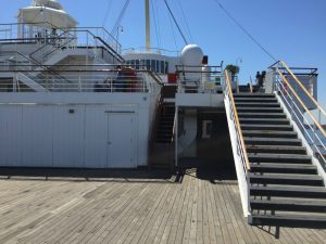 The main deck at the stern of the Queen Mary and the stairs to the promenade deck. Long Beach, CA, June 2017 (Photo: Sarah Sundin)